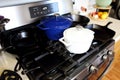 Collection of cast iron cookware on the stove top Royalty Free Stock Photo