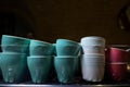 set of ceramic colored cups or mugs heating on professional coffee machine Royalty Free Stock Photo