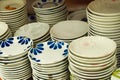 Stacks of Ceramic Plates with Floral Designs Royalty Free Stock Photo