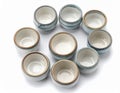 Collection of Ceramic Sake Cups Displayed on Clean White Background Royalty Free Stock Photo