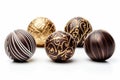 A collection of choclate pralines ornaments isolated on a white background