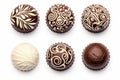 A collection of choclate pralines ornaments isolated on a white background