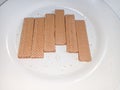 collection of chocolate wafer biscuits on a white plate Royalty Free Stock Photo