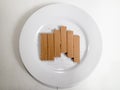 collection of chocolate wafer biscuits on a white plate Royalty Free Stock Photo