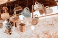 Collection of Clay pottery Cups hanging with the ropes from ceiling in coffee shop Royalty Free Stock Photo