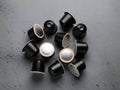Collection of coffee pods arranged in a circular pattern Royalty Free Stock Photo