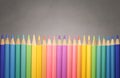 collection of color pencild laying in row striaght line made by pencil tips with grey background close up, Color pancils, copy Royalty Free Stock Photo