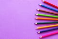 Collection of colored pencils on a purple background top view and copy space. Education, Back to school. Concept Royalty Free Stock Photo