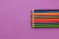 Collection of colored pencils on a purple background top view and copy space. Education, Back to school. Concept Royalty Free Stock Photo