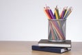 Collection of colored pencils in a wire basket Royalty Free Stock Photo