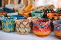 collection of colorful boho-style woven baskets