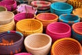 collection of colorful boho-style woven baskets