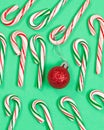 Collection of colorful candy canes and ornament on green backgro Royalty Free Stock Photo