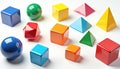 Collection of colorful 3D geometric shapes like cubes spheres and pyramids on white background. These objects represent early Royalty Free Stock Photo