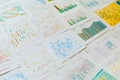 various colorful scientific charts and graphs laid out on a white surface showing data analysis and research results in multiple f Royalty Free Stock Photo
