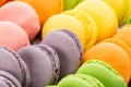 Collection of colorful French macarons closeup as a background. Selective focus