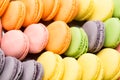 Collection of colorful French macarons closeup as a background. Selective focus