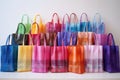 collection of colorful gift bags with matching tissue paper