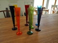 Collection of colorful glass vases on a table