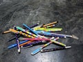Collection of Colorful Patterned Pens Scattered on Marble Surface Royalty Free Stock Photo