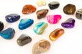 Collection of colorful semiprecious gemstones on white background