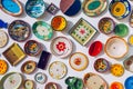 Collection of colorful Portuguese ceramic pottery, local craft products from Portugal. Ceramic plates display in Portugal.