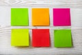 Collection of colorful post it paper note on white wooden background Royalty Free Stock Photo