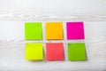 Collection of colorful post it paper note on white wooden background Royalty Free Stock Photo