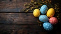 Speckled Easter Eggs with Floral Branches on Rustic Wooden Background with copy space Royalty Free Stock Photo