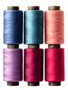 A collection of colorful spools of thread arranged neatly on a white background Royalty Free Stock Photo