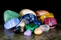 Collection of colorful trumbled mineral stones, gemstones and healing stones