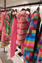 Collection of colorful women`s clothing from Valentino on a hang