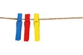 Collection of colorful wooden clothes pin and clothes line rope isolated on white background with clipping path Royalty Free Stock Photo