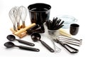 a collection of cooking utensils, including pots and pans, whisks and spoons, arranged on a white background Royalty Free Stock Photo