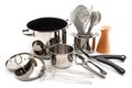 a collection of cooking utensils, including pots and pans, whisks and spoons, arranged on a white background Royalty Free Stock Photo