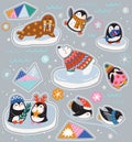 Collection of cute cartoon stickers with winter animals wearing in sweaters, hats and scarves