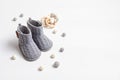 Collection of cute organic baby clothes and booties. Warm gender neutral outfit for cold weather Royalty Free Stock Photo