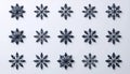 Collection of dark blue snowflake ornaments arranged in a grid pattern on a light background, creating a festive and elegant Royalty Free Stock Photo