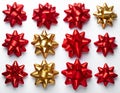 Collection of Decorative Red and Gold Starburst Shaped Bows on White Surface Royalty Free Stock Photo