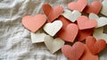 Collection of delicate paper hearts on textured fabric Royalty Free Stock Photo