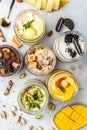 Collection of delicious ice cream served in a glass jar, italian dessert gelato pistachio, chocolate, caramel, melon, mango, Royalty Free Stock Photo