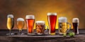 Collection of different beer glasses and beer types on old wooden table Royalty Free Stock Photo