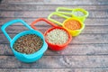 Collection of different cereals in multi-colored containers, Oatmeal buckwheat
