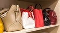 Collection of different handbags in woman closet