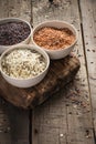 Collection of different varieties of rice on wooden rustic background Royalty Free Stock Photo