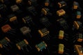 A collection of diverse electronic capacitors arranged in a gradient, showcasing size and type variation. An artistic arrangement Royalty Free Stock Photo