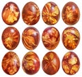 Collection of Dozen Easter Eggs Red Dyed and Decorated with Leaves Imprints Isolated on White Background