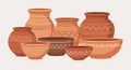 A collection of earthenware pots in various shapes and sizes, featuring reddish-brown Royalty Free Stock Photo
