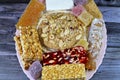 collection of Eastern candy chickpeas, peanuts, sesame, creamy taffy, sugar jelly, nuts, pistachios, hazelnuts disc as a Royalty Free Stock Photo