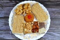 collection of Eastern candy Shakalama coconut macaroons with cherry, Noga with hazelnuts and almonds, peanuts, sesame bar,